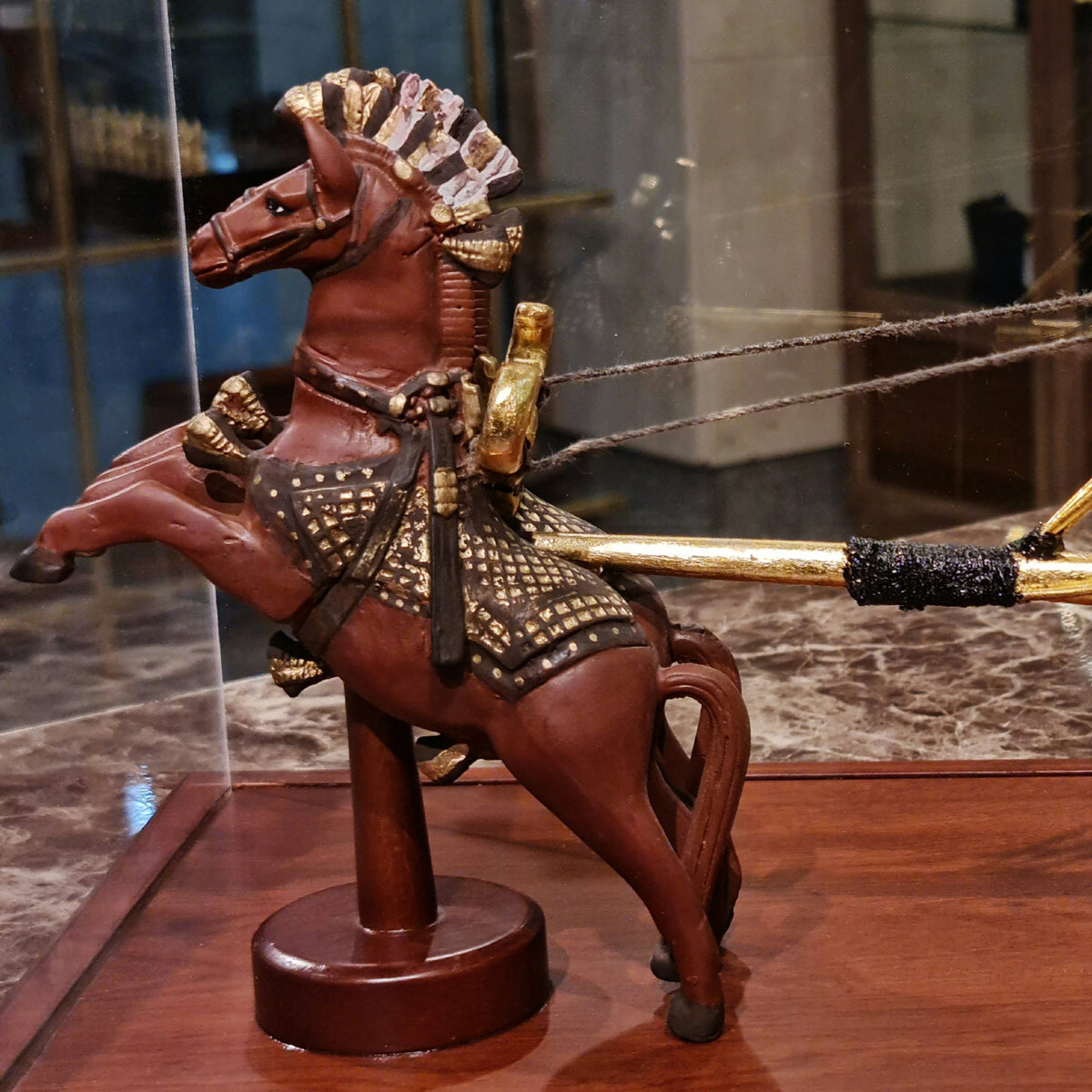 Close-up of gold-plated detail on premium war chariot replica