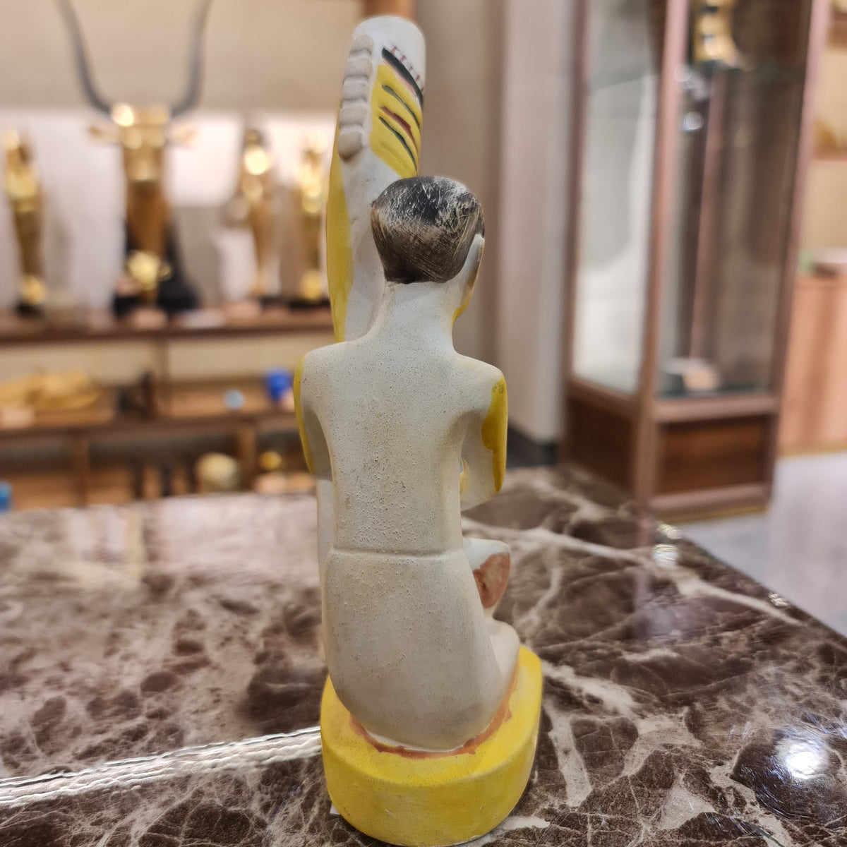 Ancient Egyptian statue museum reproduction shown from the side