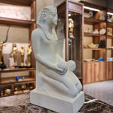 Kneeling Thutmose III statue museum reproduction, side profile