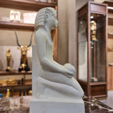 Full view of the kneeling Thutmose III statue museum reproduction