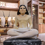Ancient Egyptian seated scribe statue museum reproduction, front view