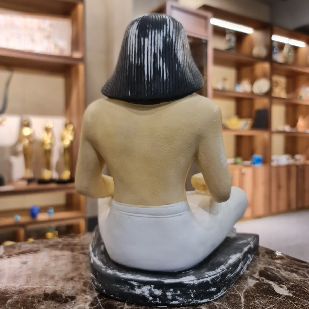 Seated scribe statue museum reproduction shown for scale