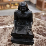 Black Ancient Egyptian seated scribe statue museum reproduction, front view