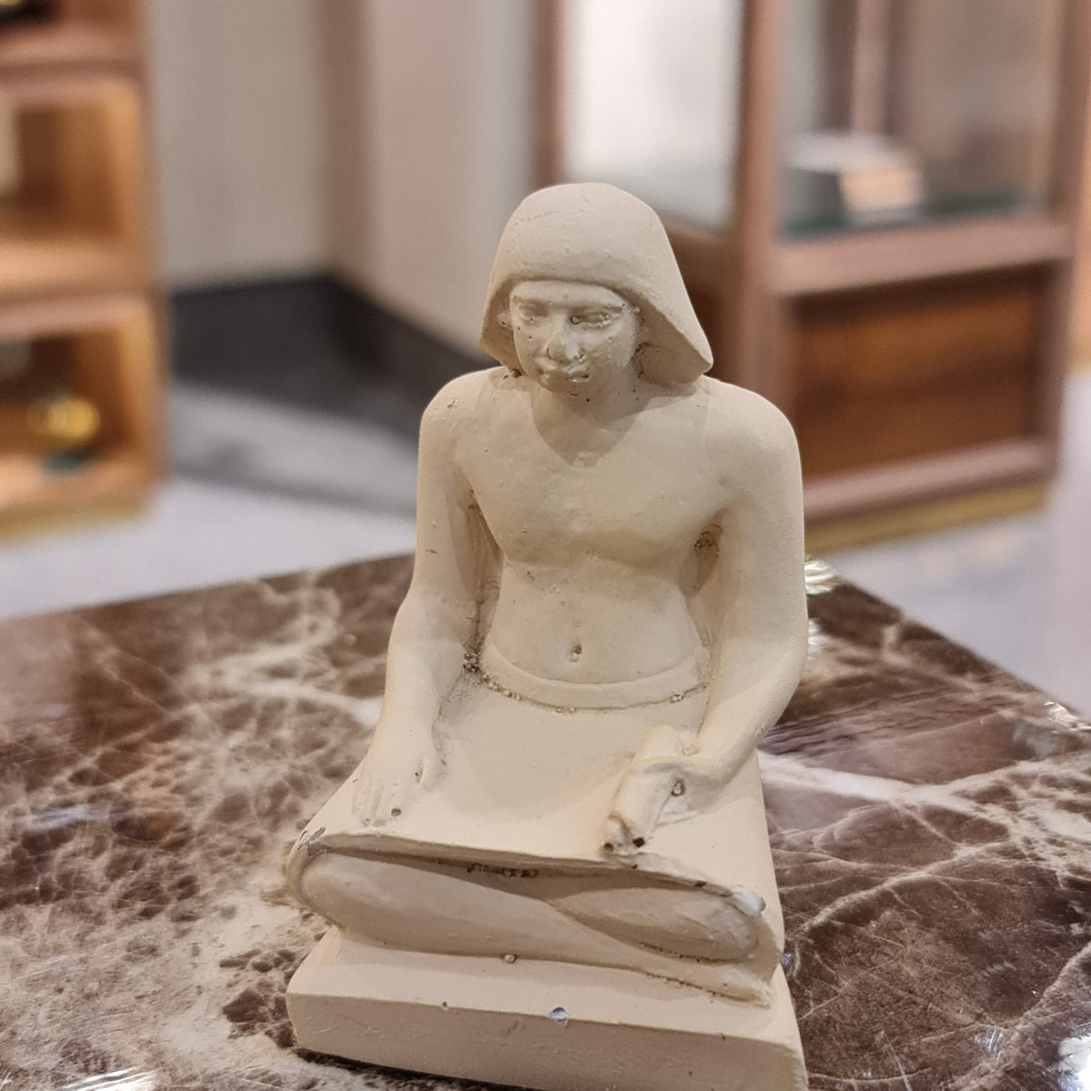 Seated scribe statue museum reproduction, Style 2, close-up detail