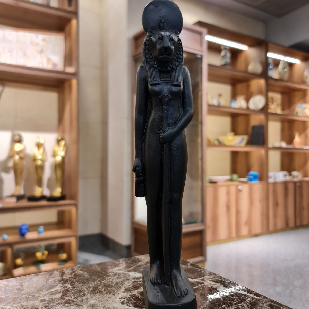 Black Egyptian goddess Sekhmet standing statue museum reproduction, front view