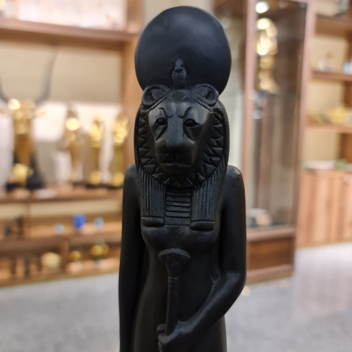 Sekhmet lioness-head statue museum reproduction, close-up detail