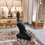 Close-up of the Horus falcon statue's head and crown detail
