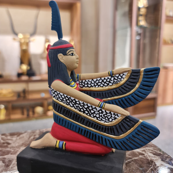 A fabulous Statue of the Winged Goddess Ma'at adorned with an ostrich feather