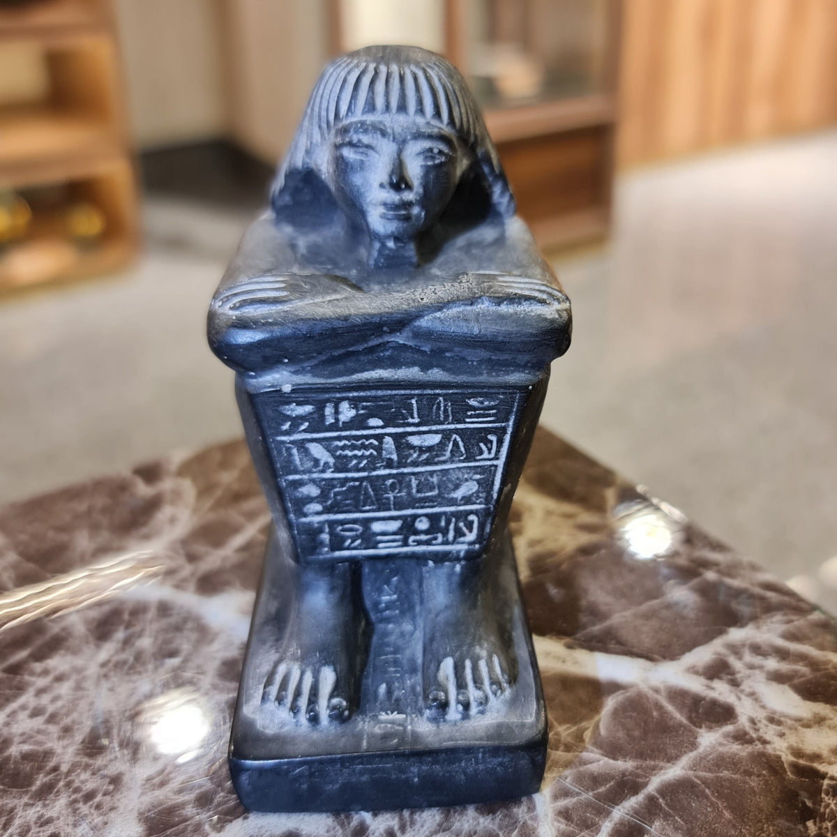 Front view of black cube block statue, small size, museum reproduction
