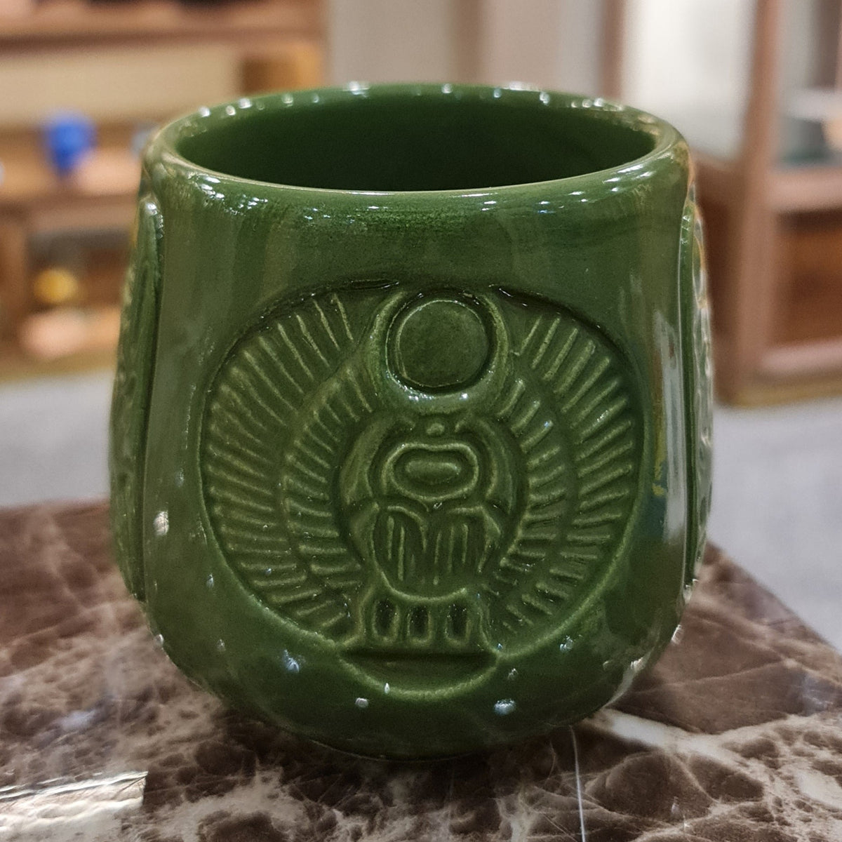 Handmade porcelain Egyptian mug with scarab beetle design