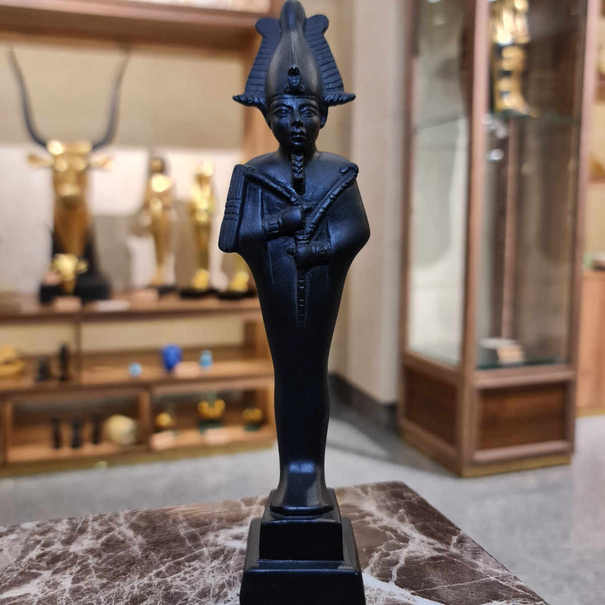 Black Osiris statue, museum reproduction, front view