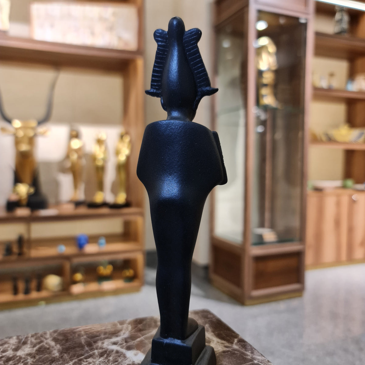 Osiris museum reproduction statue shown from the side