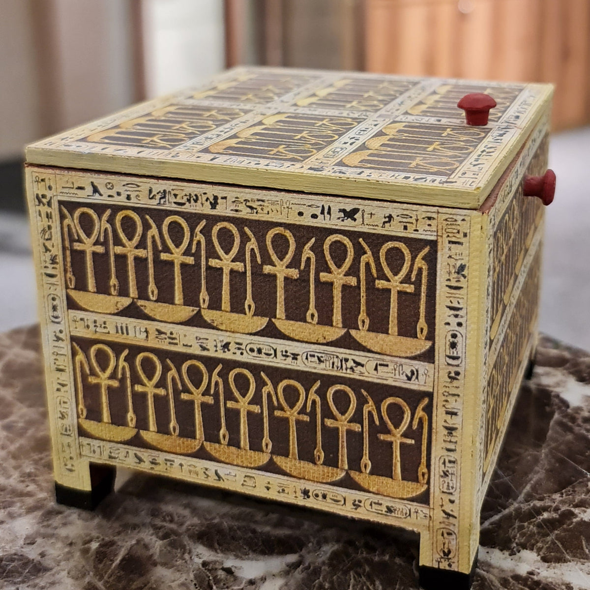 Tutankhamun-motif wooden keepsake box, lid open showing interior