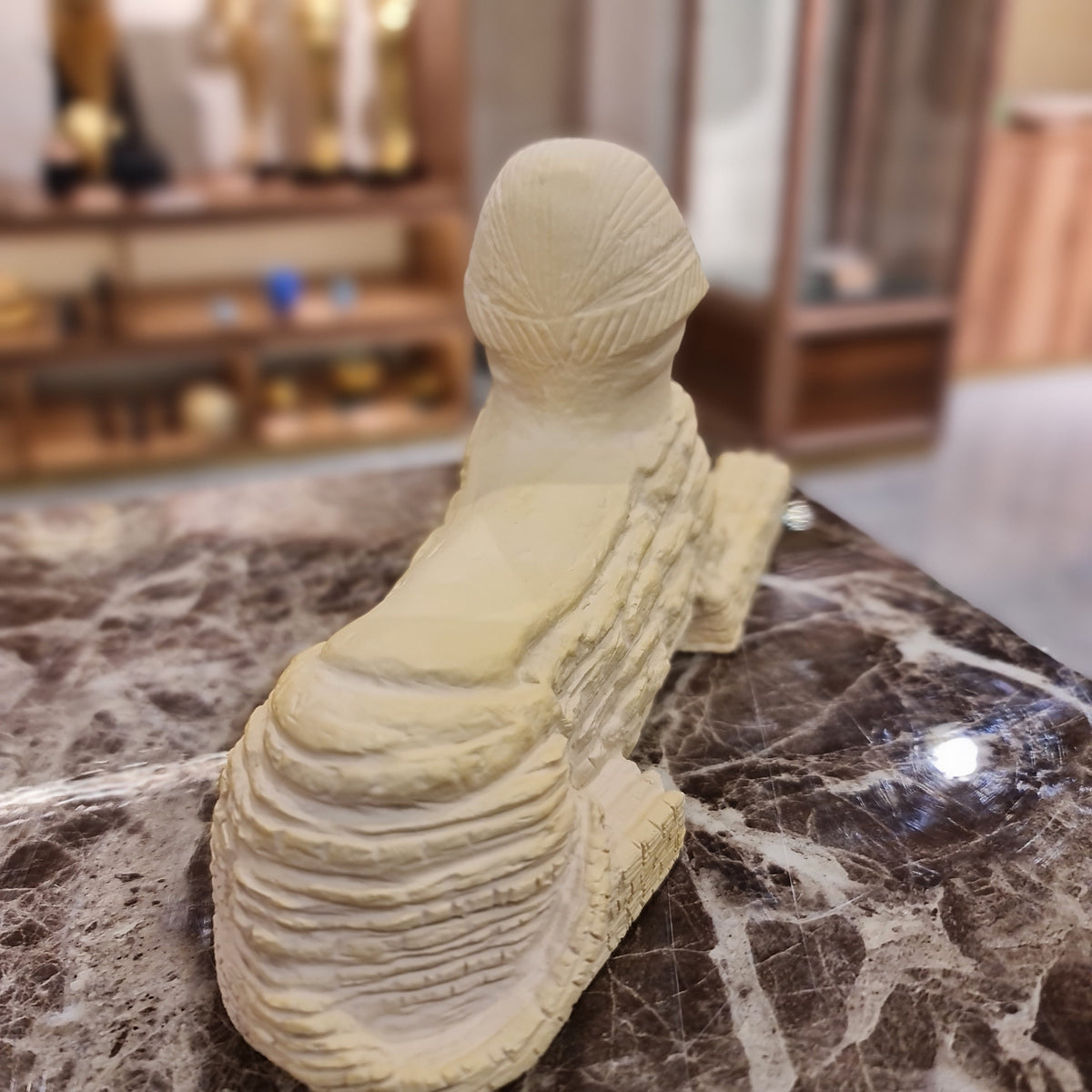 Stone Sphinx statue museum reproduction shown for scale