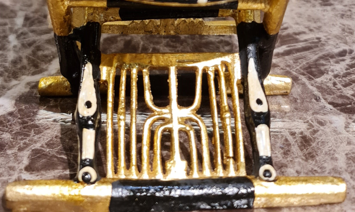 Ceremonial throne of King Tutankhamun museum reproduction shown with plexiglass cover