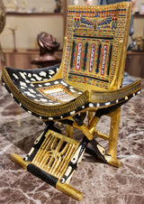 Ceremonial throne of King Tutankhamun museum reproduction, detail of gilded carving