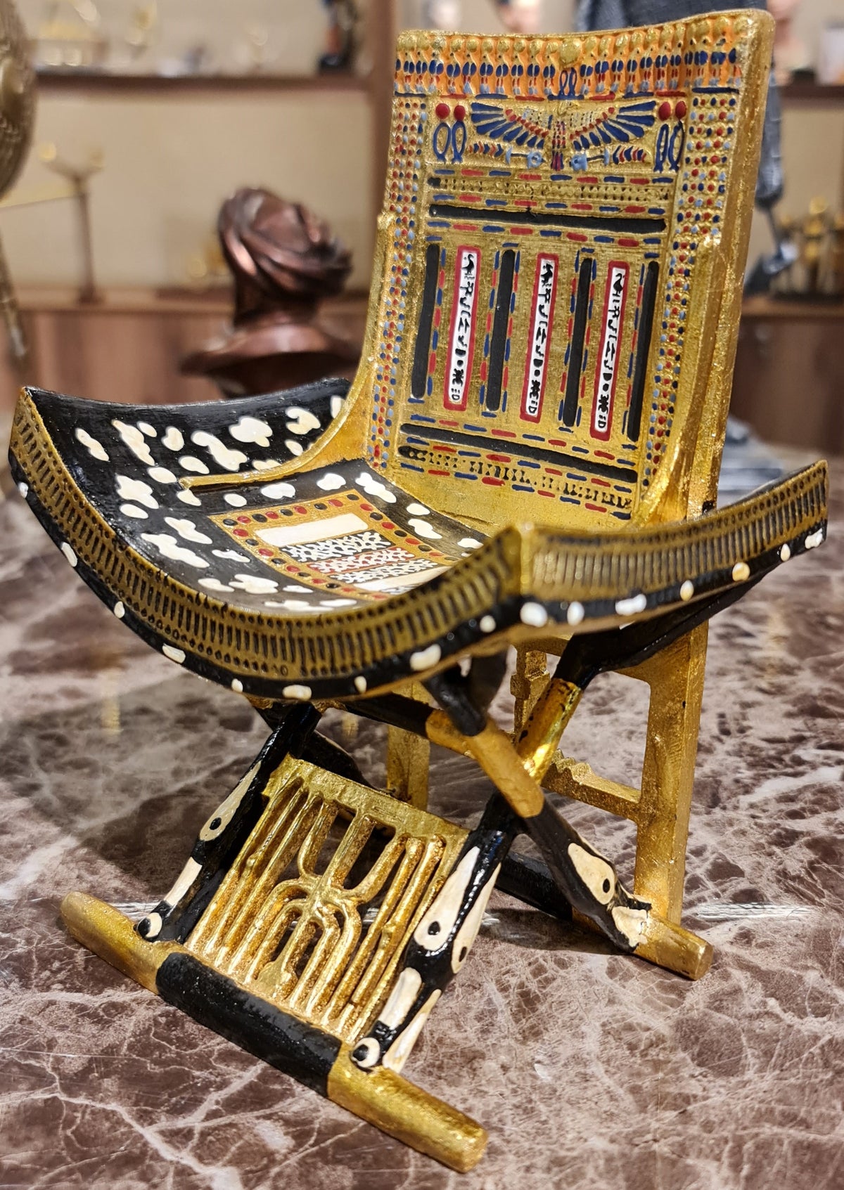 Ceremonial throne of King Tutankhamun museum reproduction, detail of gilded carving