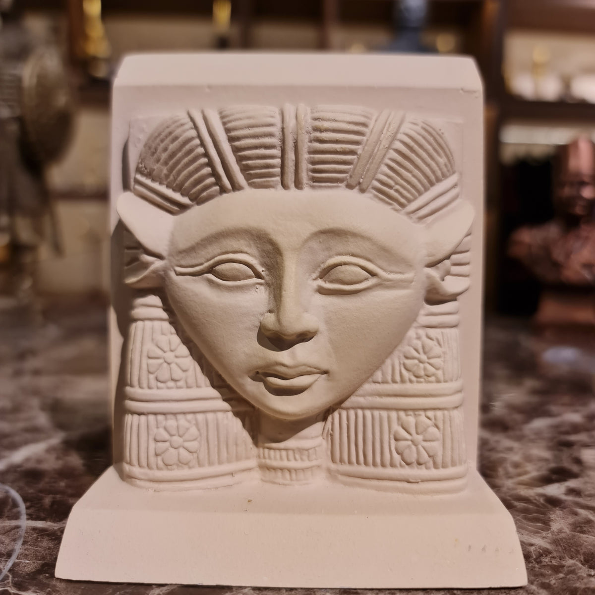 Hathor head sculpture, limestone museum reproduction, front view