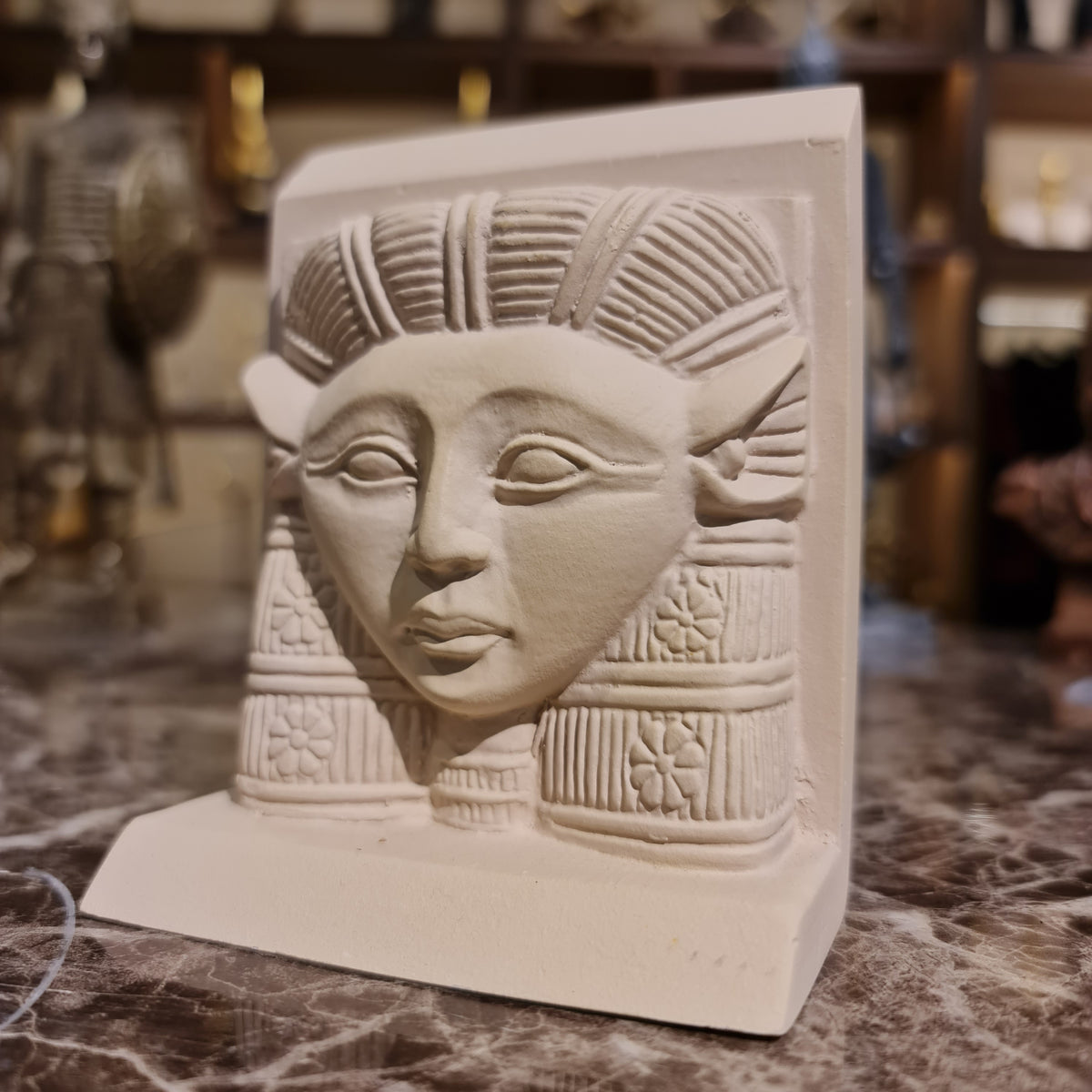 Hathor head sculpture, back view