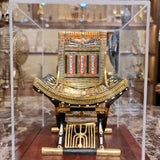 Ceremonial throne of King Tutankhamun in its plexiglass case, museum reproduction, front view
