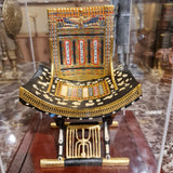Close-up of the vulture goddess and cartouche detail on the ceremonial throne's backrest