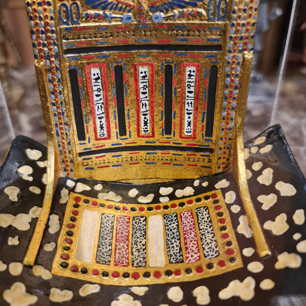 Ceremonial throne of King Tutankhamun museum reproduction, shown at an angle