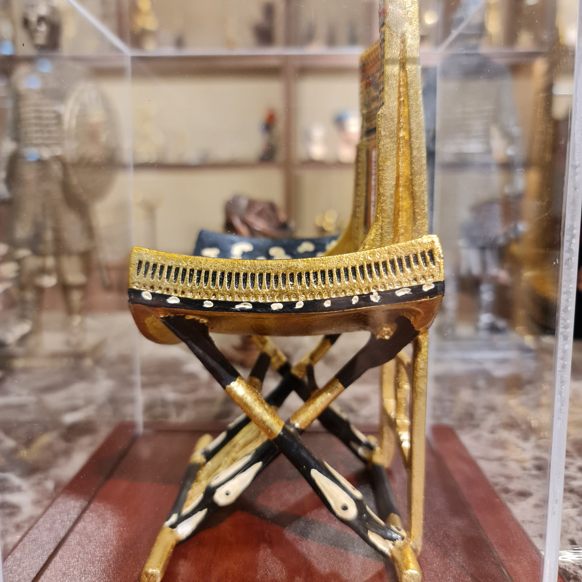 Ceremonial throne of King Tutankhamun museum reproduction, plexiglass display case detail