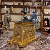 Detail of the gold and colored finish on the Anubis shrine statue, museum reproduction