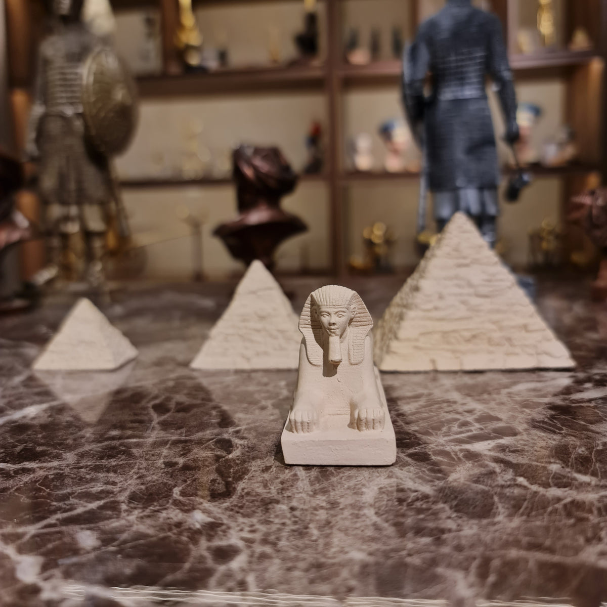 Three Pyramids and Great Sphinx of Giza stone reproduction displayed on a shelf