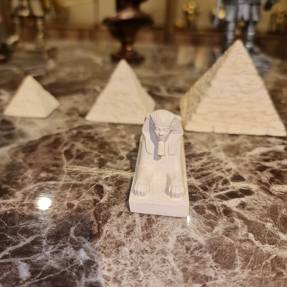 Small stone Pyramids and Sphinx of Giza reproduction, angled view showing pyramid detail
