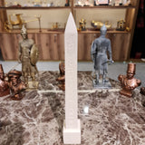 Thutmose III obelisk reproduction displayed upright on a stand