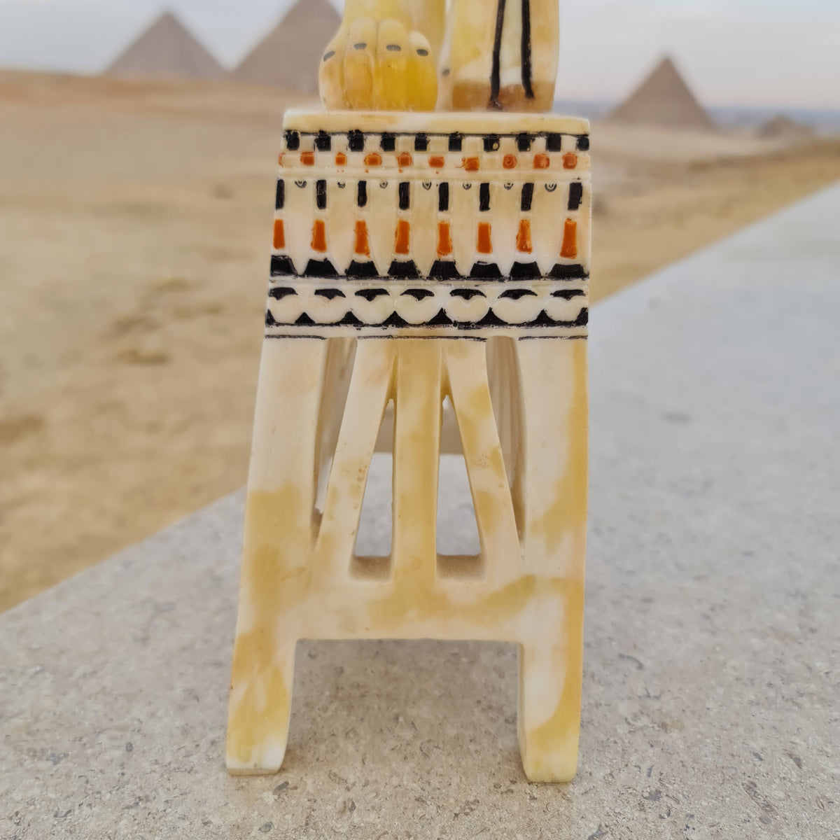 Lion unguent jar replica displayed on stand