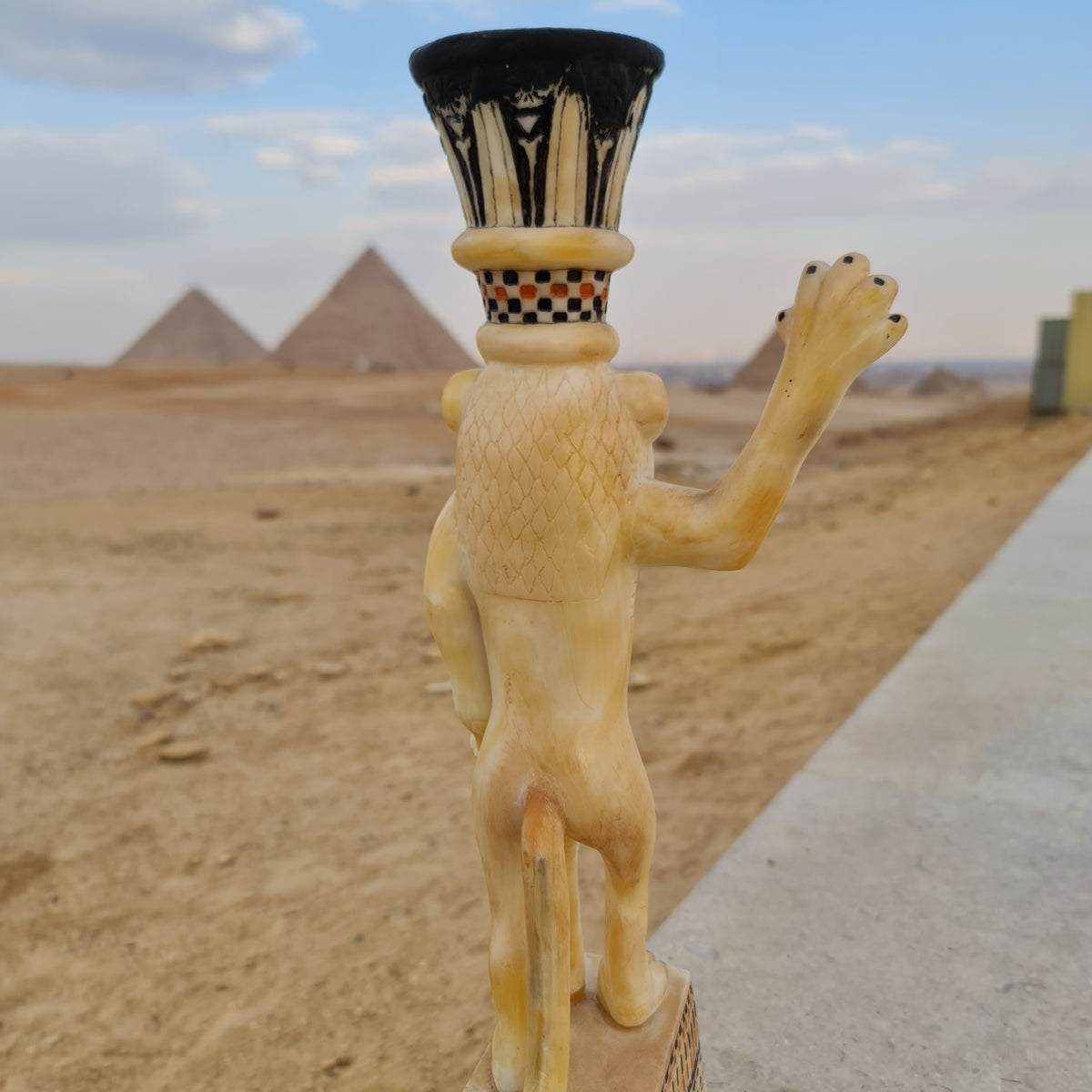 Angled view of lion unguent jar craftsmanship