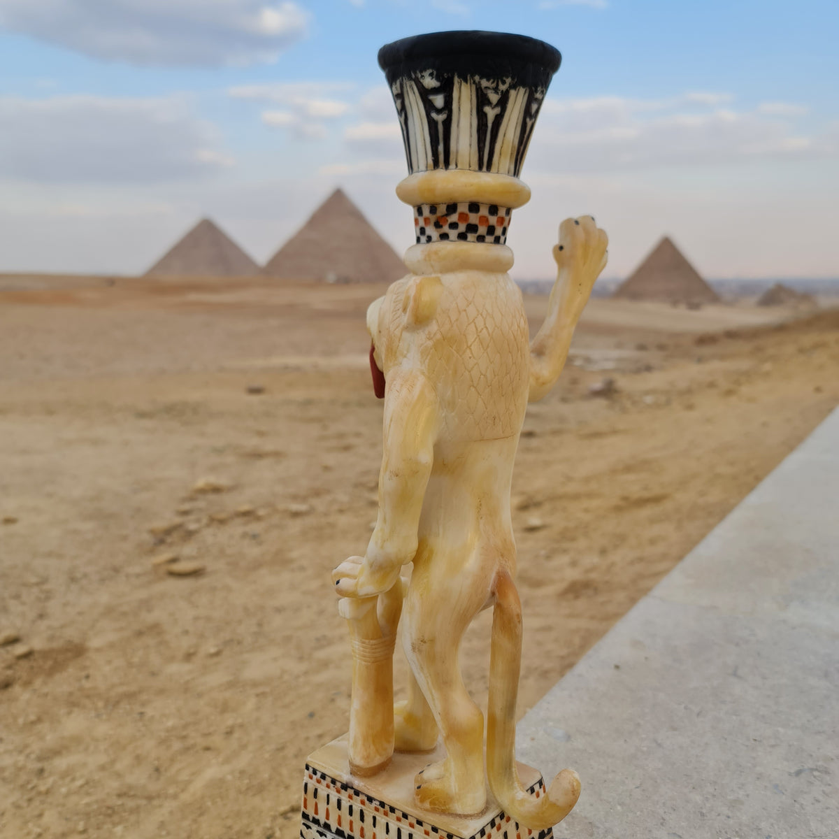 Front view of lion-shaped unguent jar museum reproduction