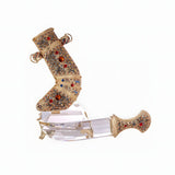 Close-up of gold-plated blade detail on crystal dagger