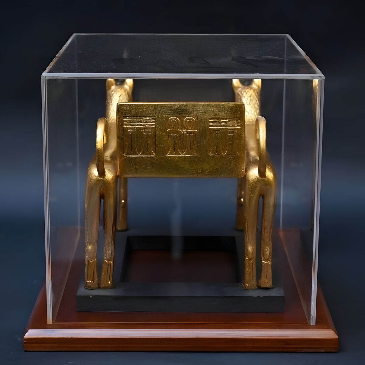 Front view of funerary bed replica on wooden base