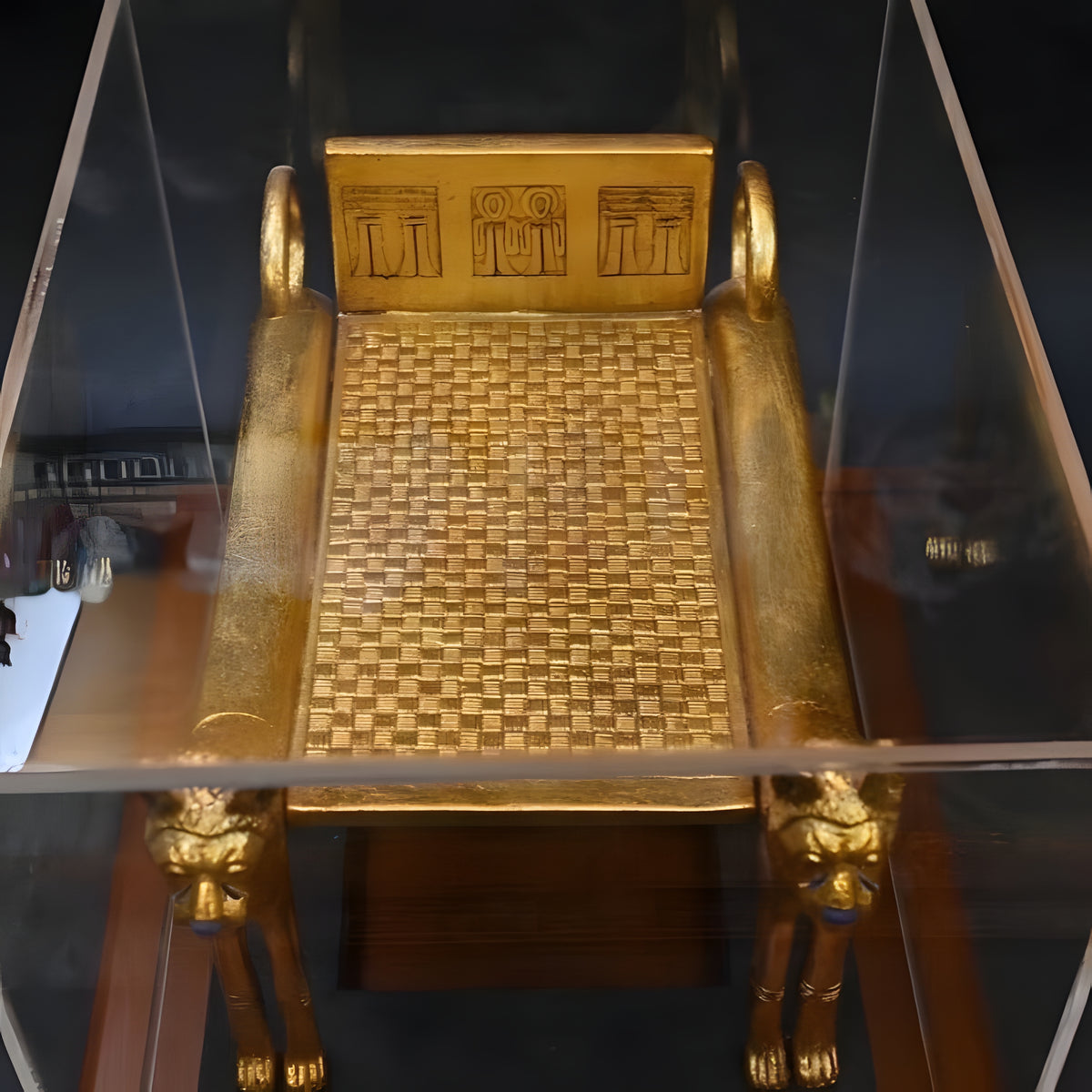 Funerary bed replica displayed with plexiglass cover