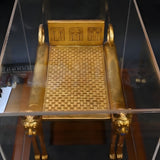 Funerary bed replica displayed with plexiglass cover
