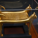 Angled view of Tutankhamun lioness bed craftsmanship