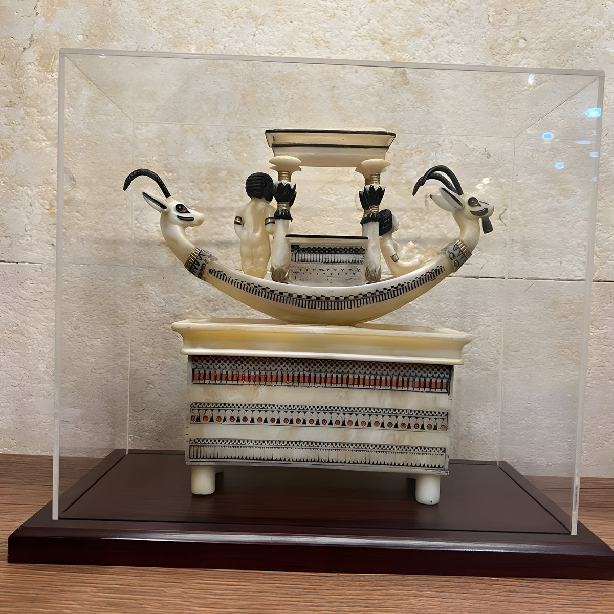 Tutankhamun ritual basin with sacred boat replica, alabaster, wooden base