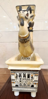 Detail of wooden base supporting alabaster ritual basin replica