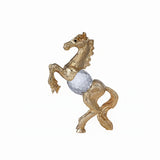 Close-up of gold-plated detail on crystal horse sculpture