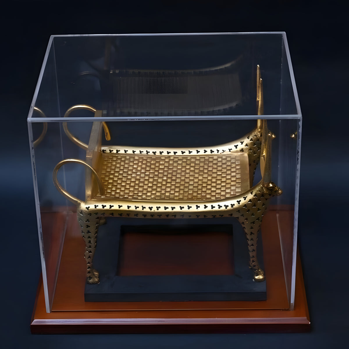Funerary bed replica displayed with plexiglass cover