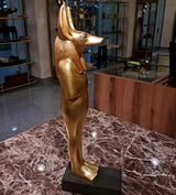 Angled view of Anubis statue craftsmanship
