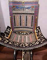 Detail of gold and brass accents on throne legs