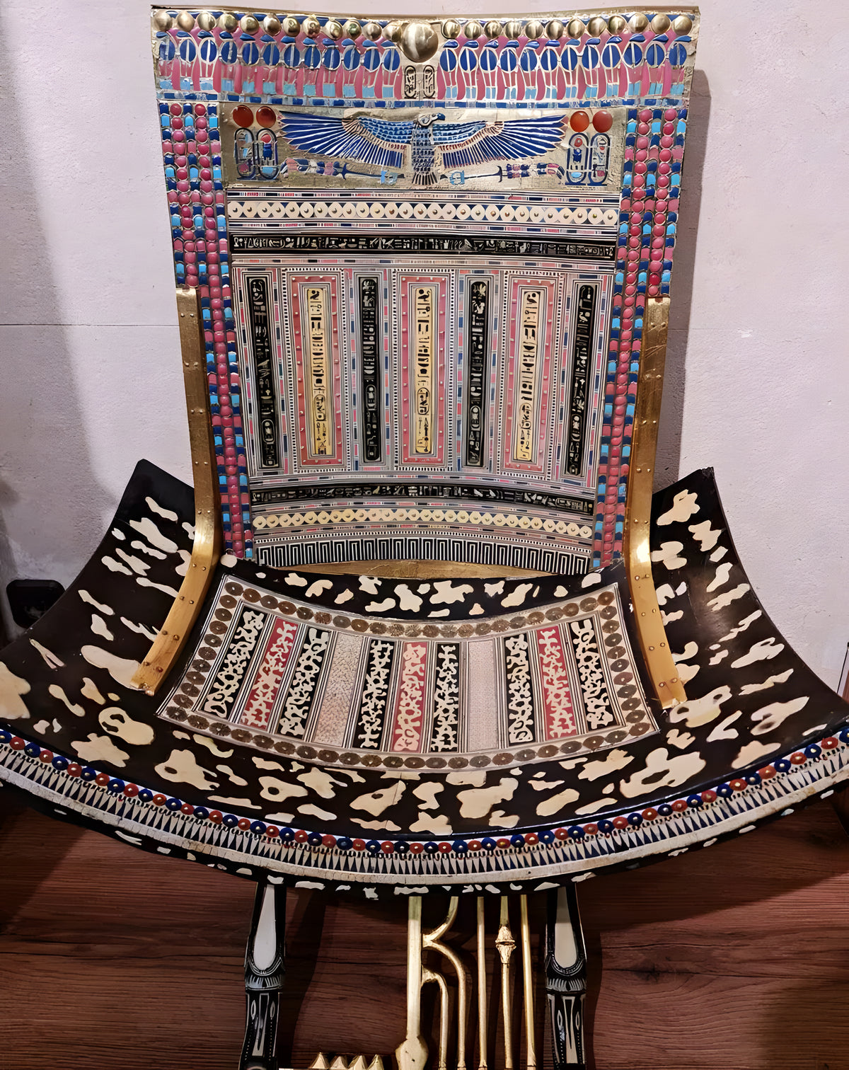 Detail of gold and brass accents on throne legs