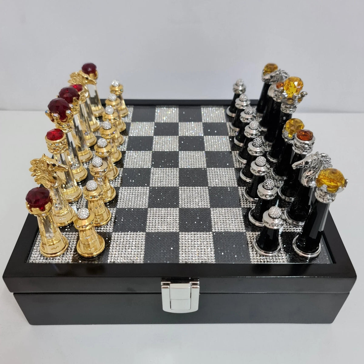 Close-up of crystal chess pieces with gold plating