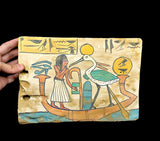 Hand-carved wooden tablet with sun god Ra motif, museum reproduction