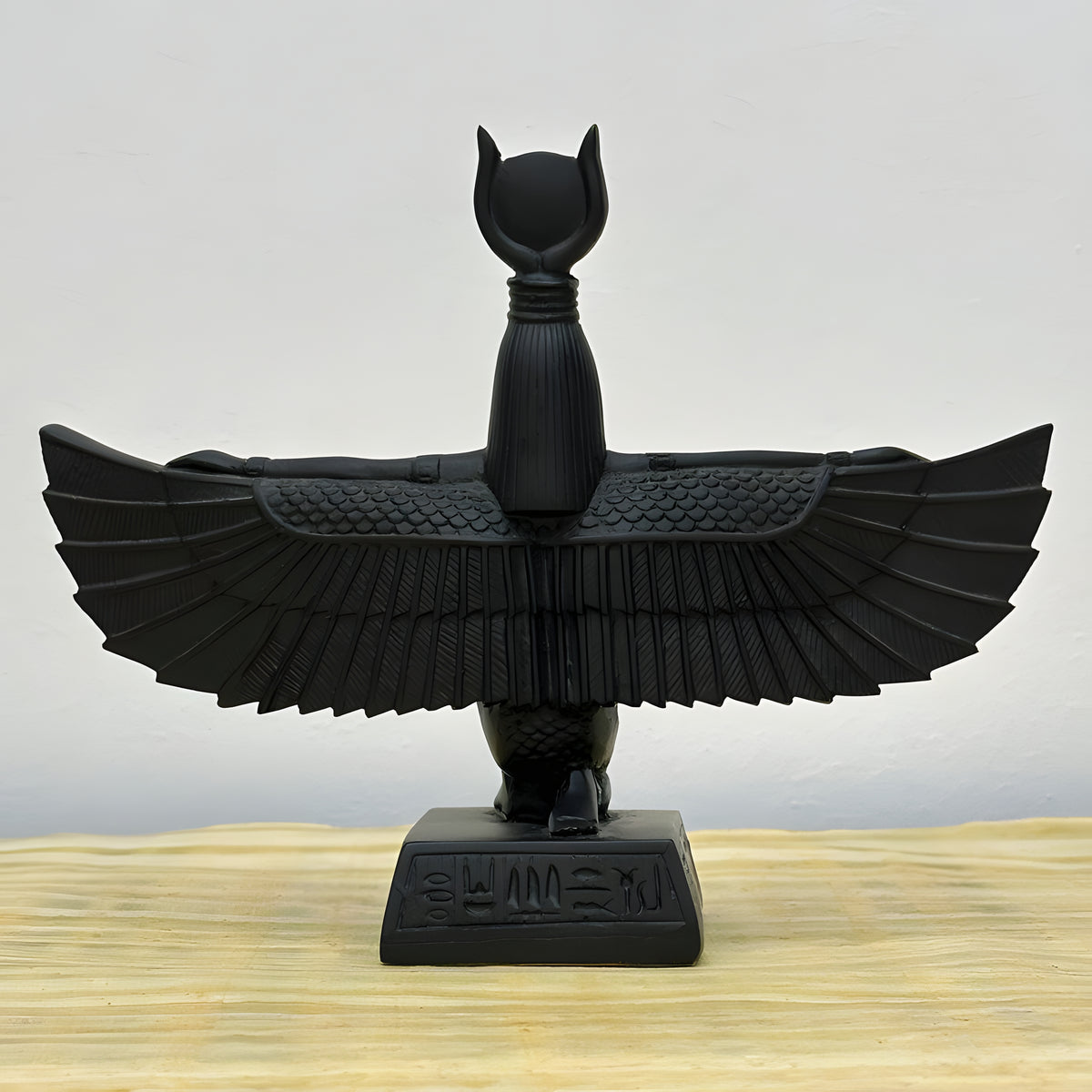 Side view of seated Isis statue replica