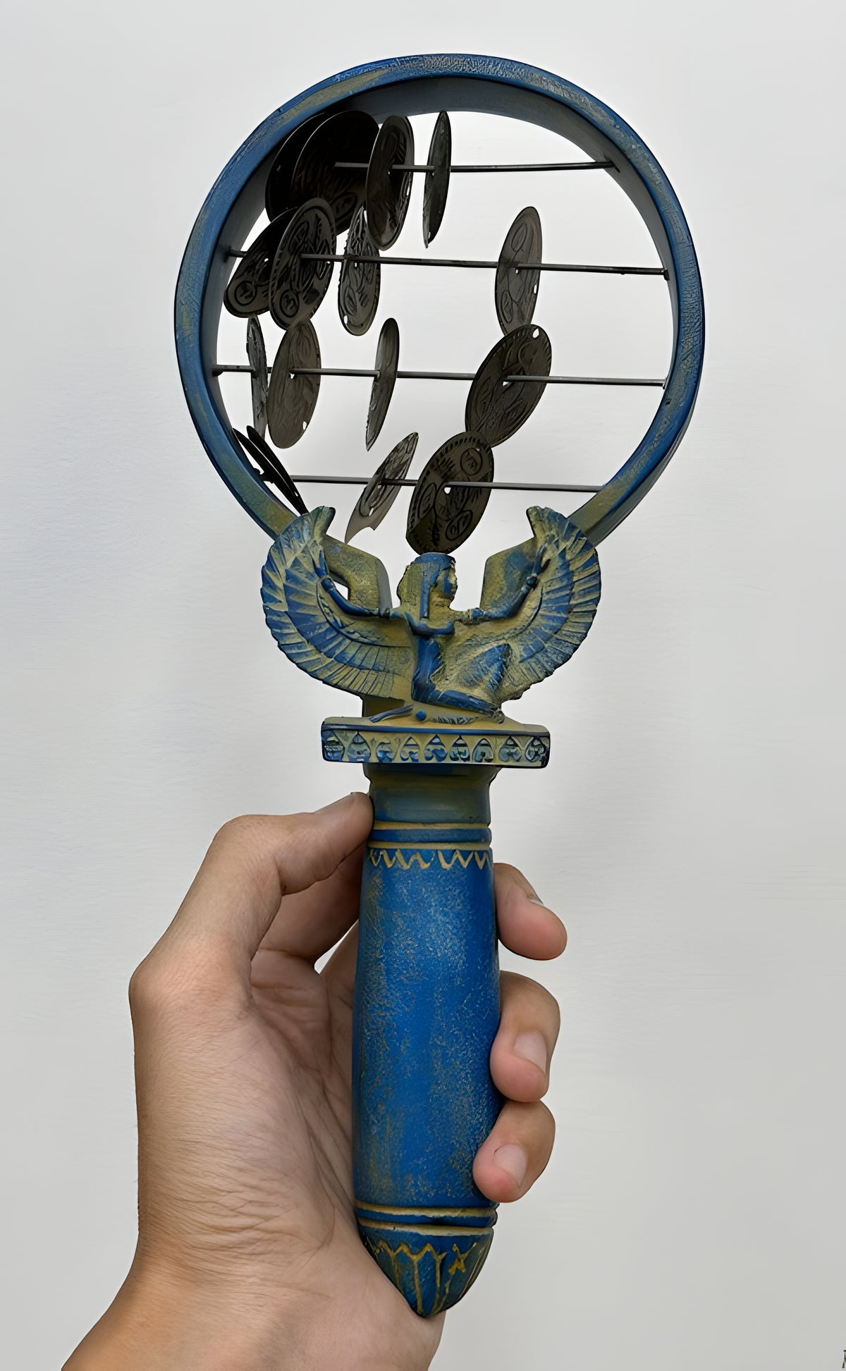 Close-up of decorative detail on sistrum replica